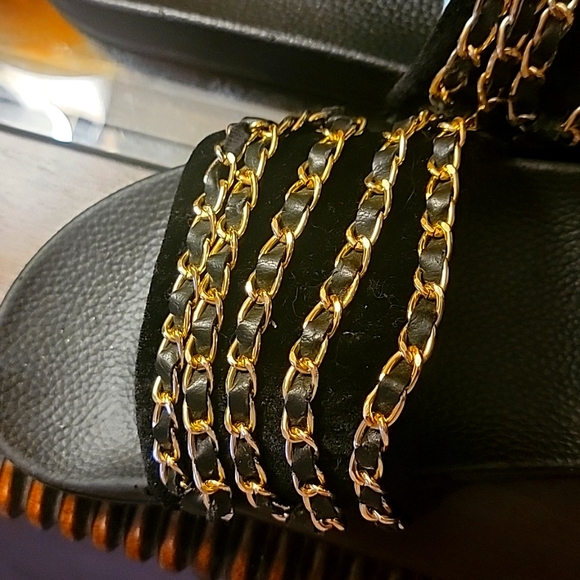 Black slides with gold chains across the top. Size 9 - Picture 4 of 7